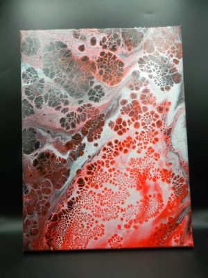 tableaux en peinture avec une technique de pouring sur une toile de tons rouge et noir pour ce modèle